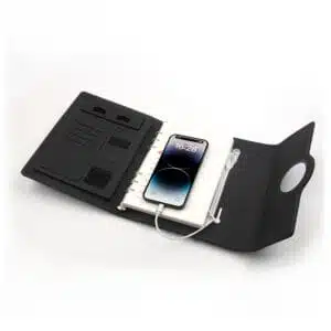 Smartphone charging wirelessly on top of Multifunctional Notebook 2.0 cover