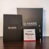 Premium appreciation box open showing branded notebook, metal pen, and greeting card